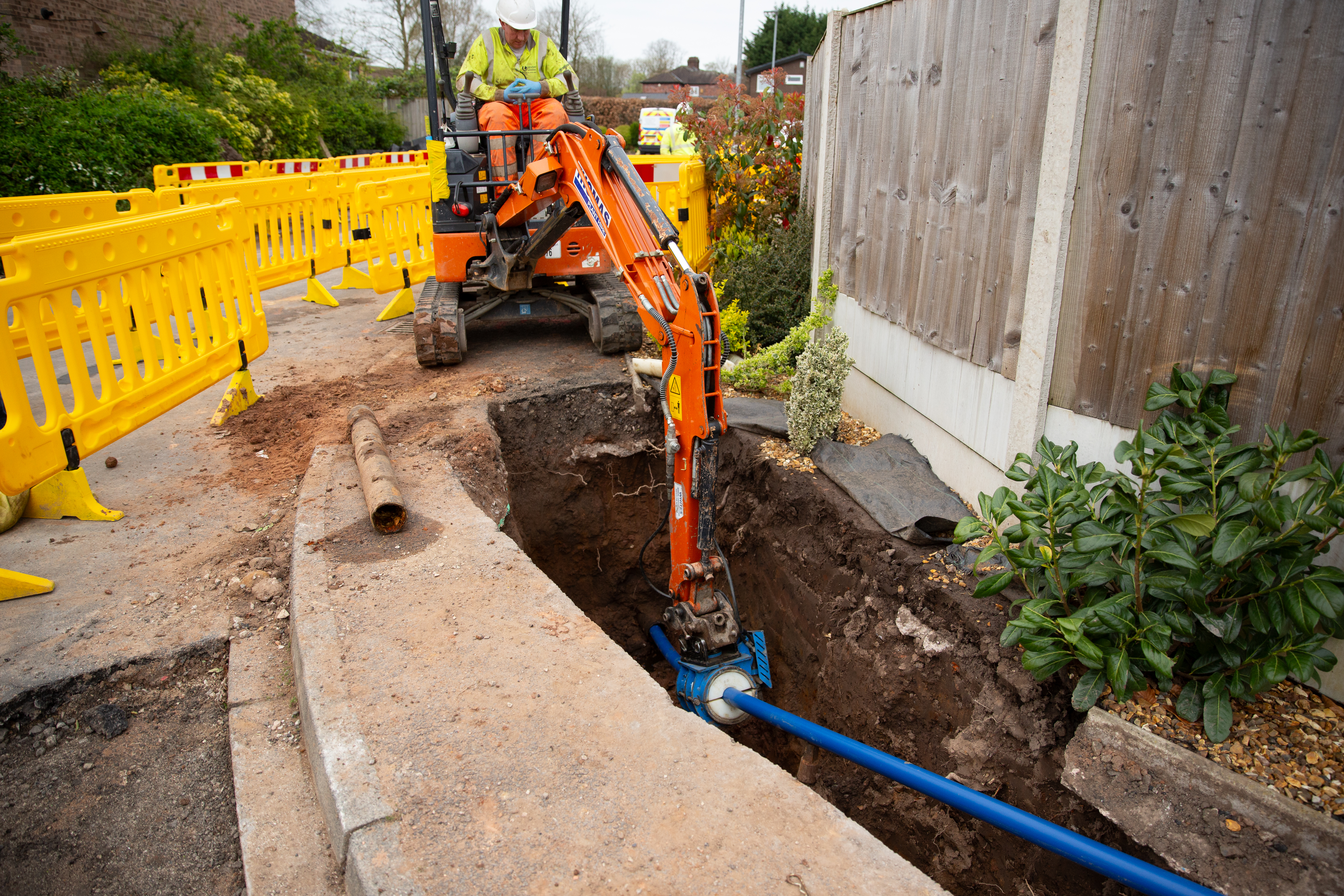 Digging up road with digger