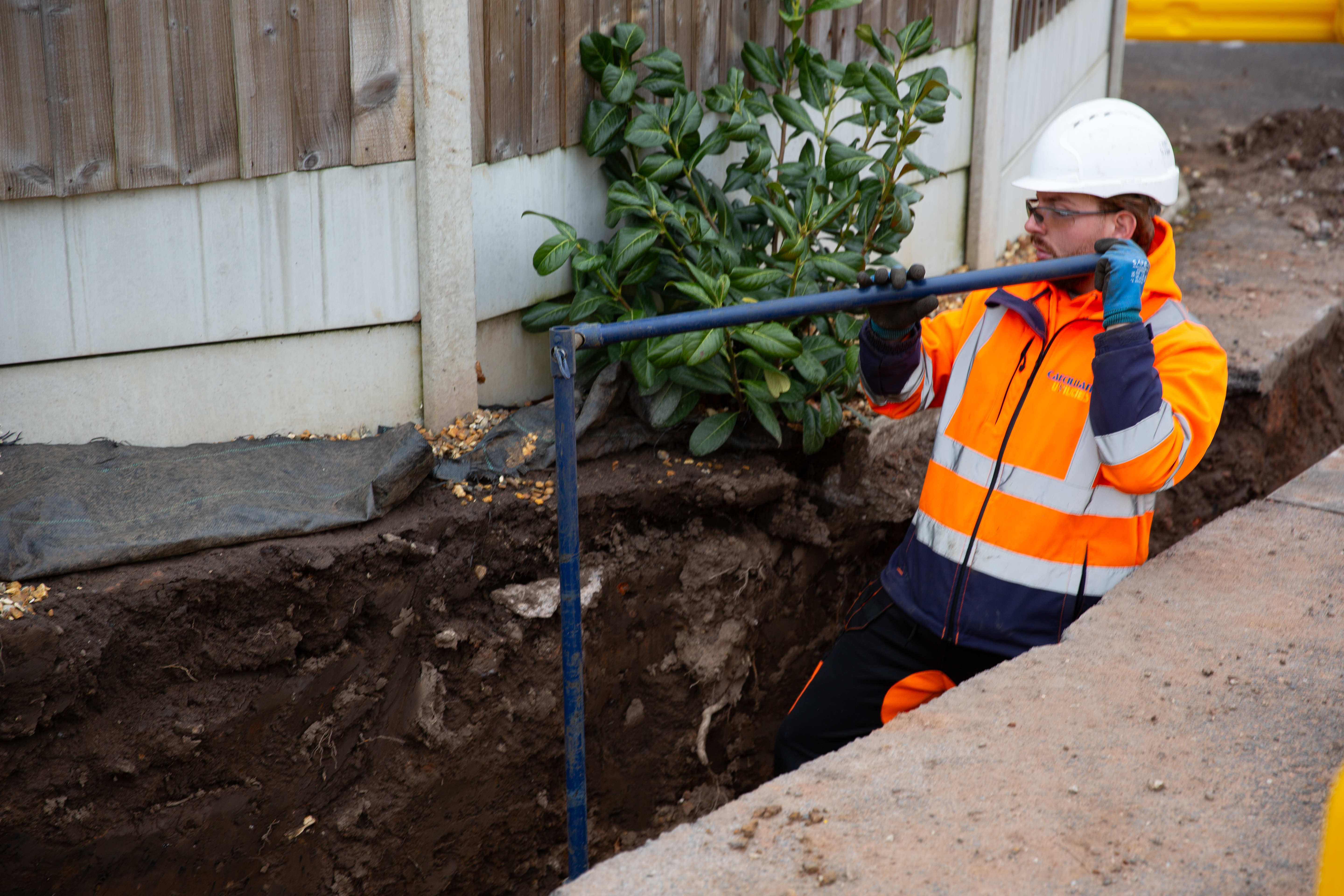Worker holding pipe