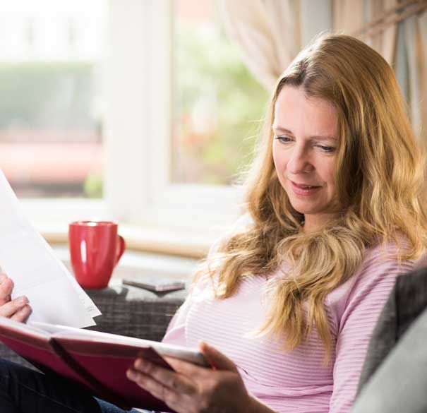 Woman reading bill