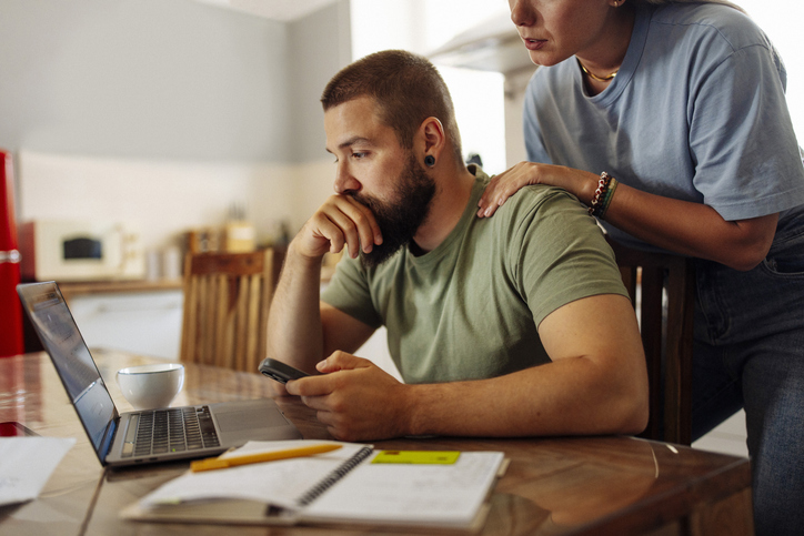 Man looking at bills